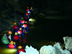 Swimming underground river in Dark cave